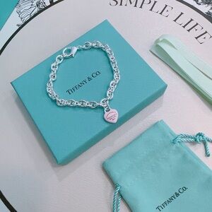 Tiffany & Co. Silver Chain Bracelet with Pink Heart Charm